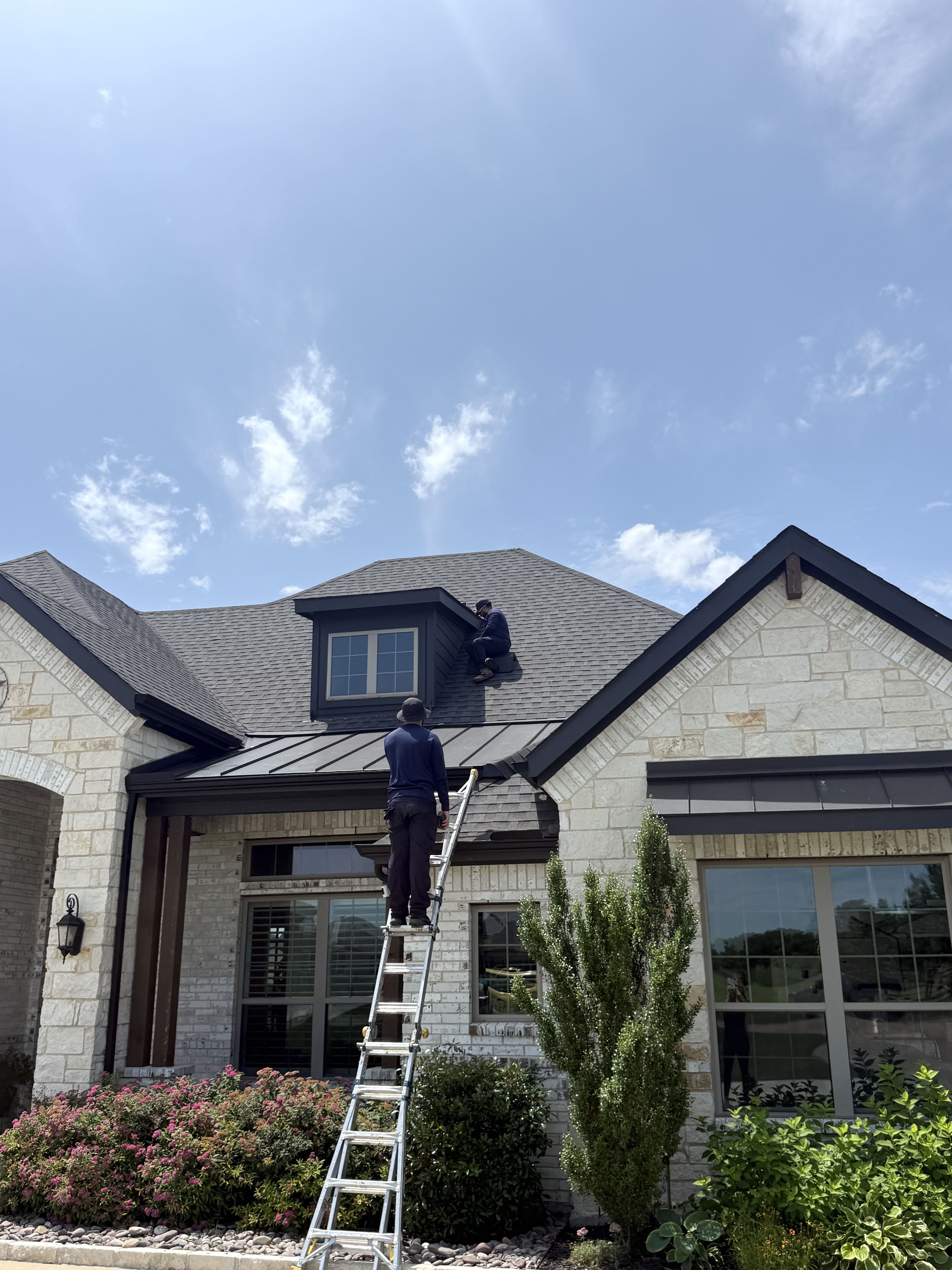 The CanMan technician inspecting an attic for entry points